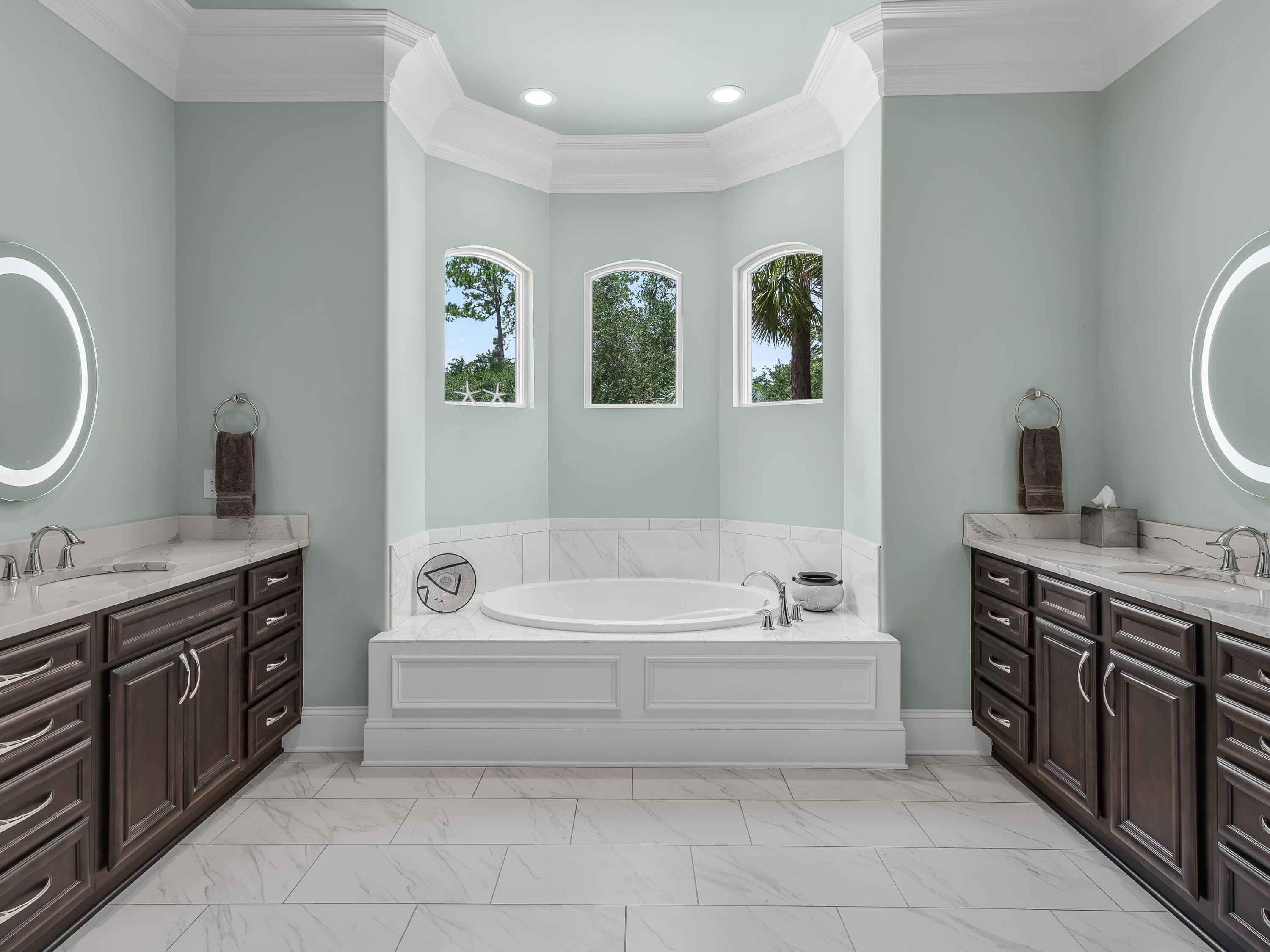2916 Pine Valley Drive Sandestin, FL 32550 - Photo 29 of 48 a spacious bathroom with a double vanity sink a mirror a bathtub and next to a window
