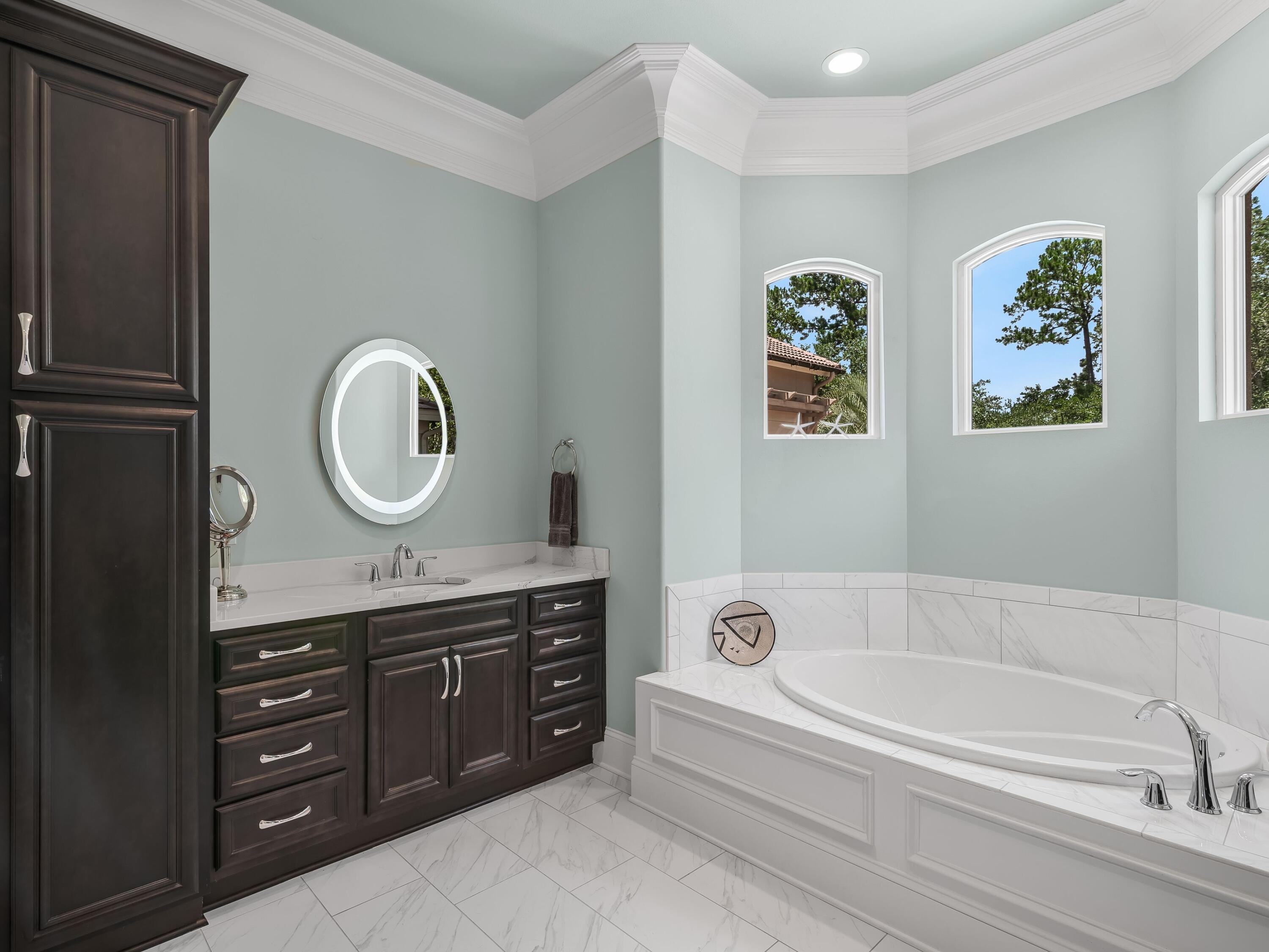 2916 Pine Valley Drive Sandestin, FL 32550 - Photo 30 of 48 a bathroom with a tub sink and mirror