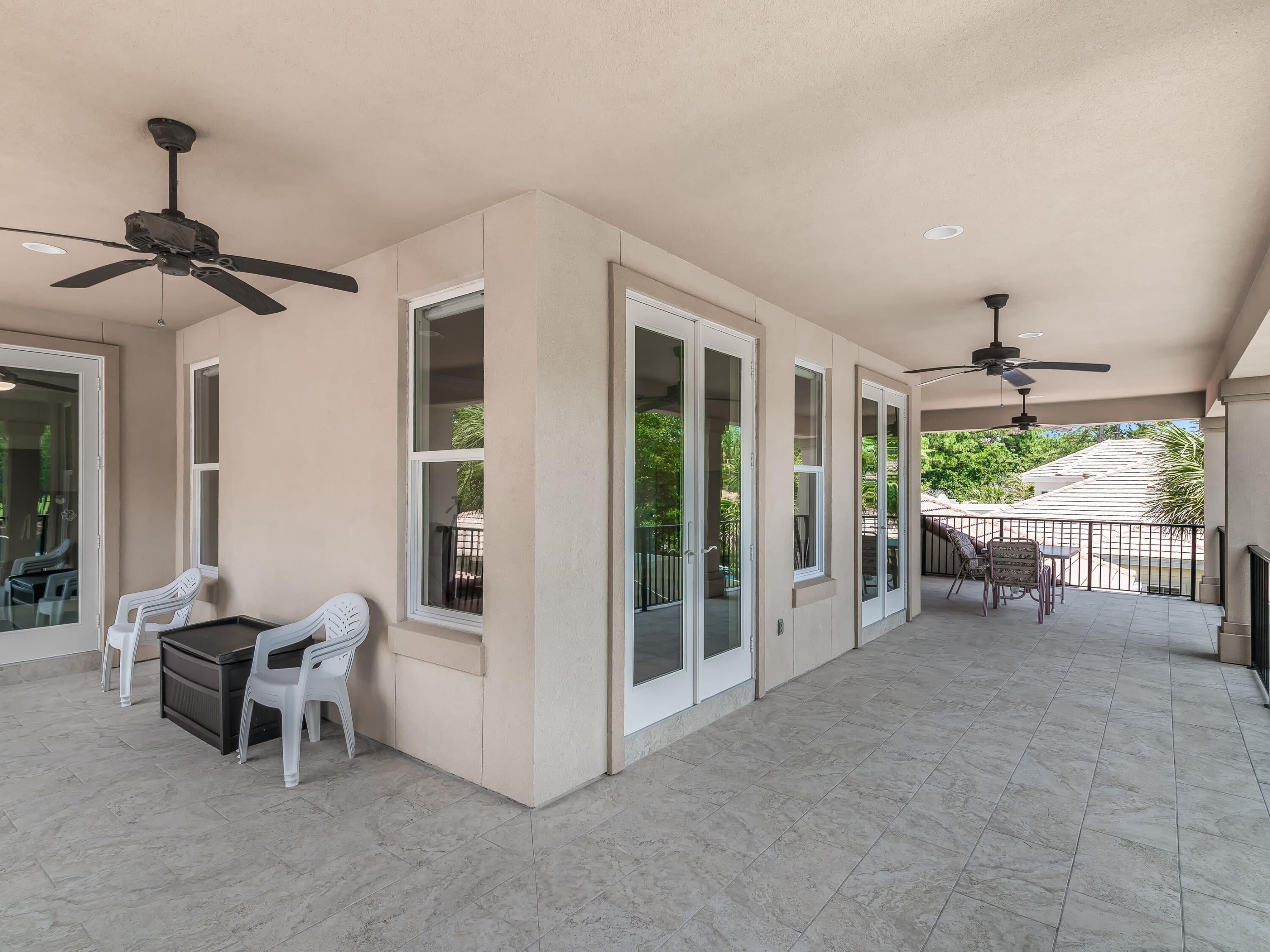 2916 Pine Valley Drive Sandestin, FL 32550 - Photo 34 of 48 a view of a room with porch and wooden floor