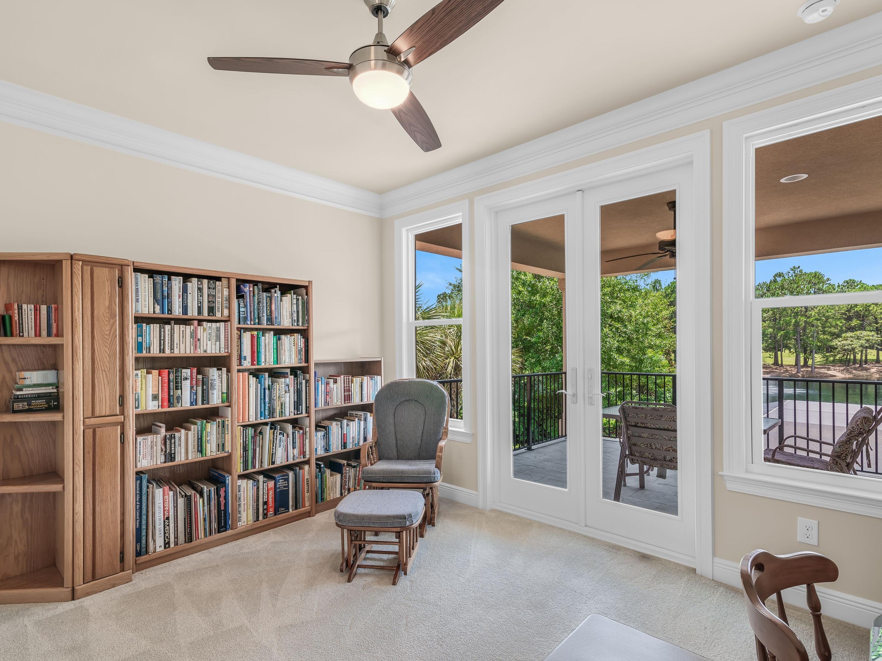 2916 Pine Valley Drive Sandestin, FL 32550 - Photo 36 of 48 a living room with furniture and a book shelf