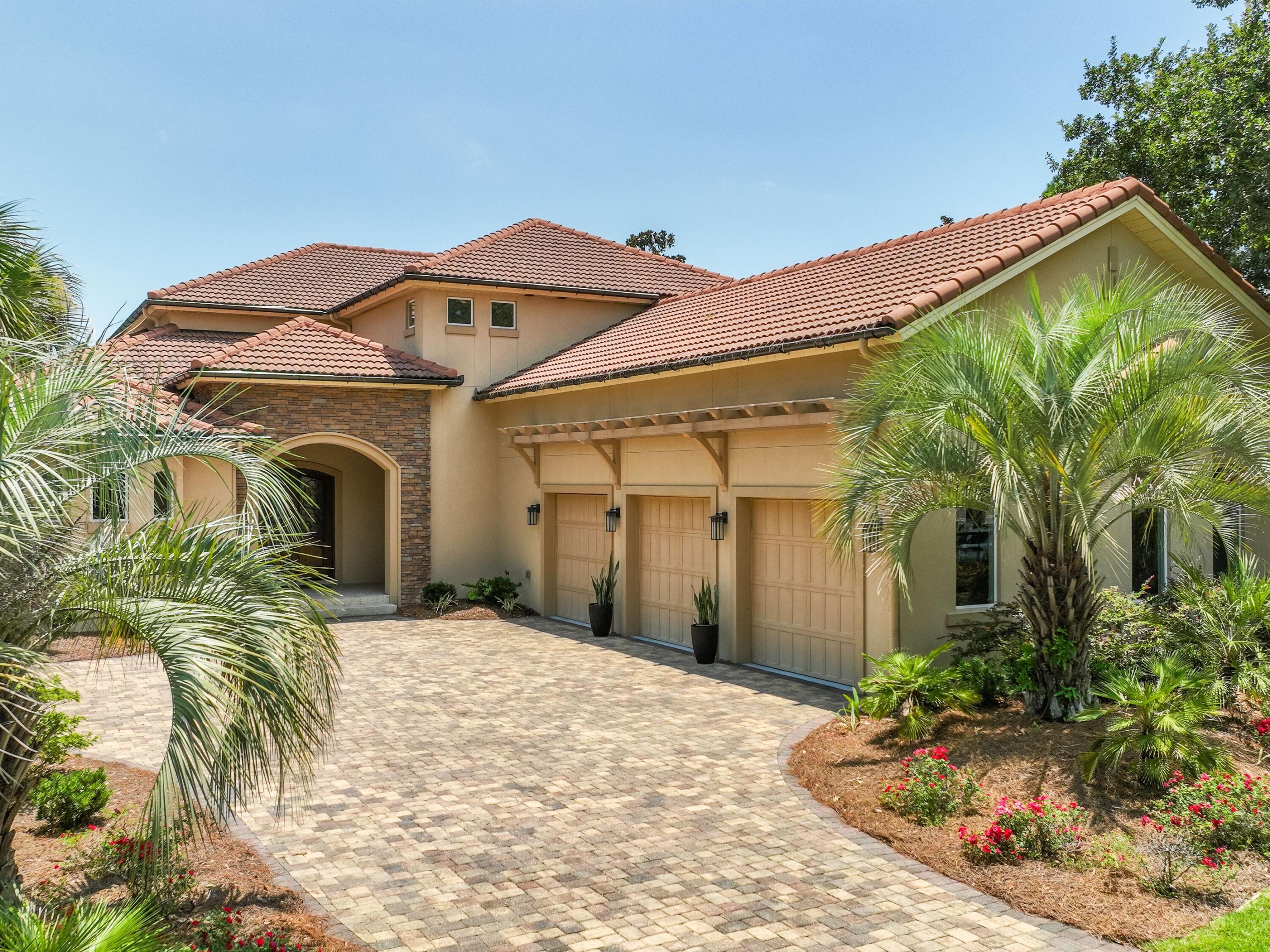 2916 Pine Valley Drive Sandestin, FL 32550 - Photo 45 of 48 a front view of a house with a yard