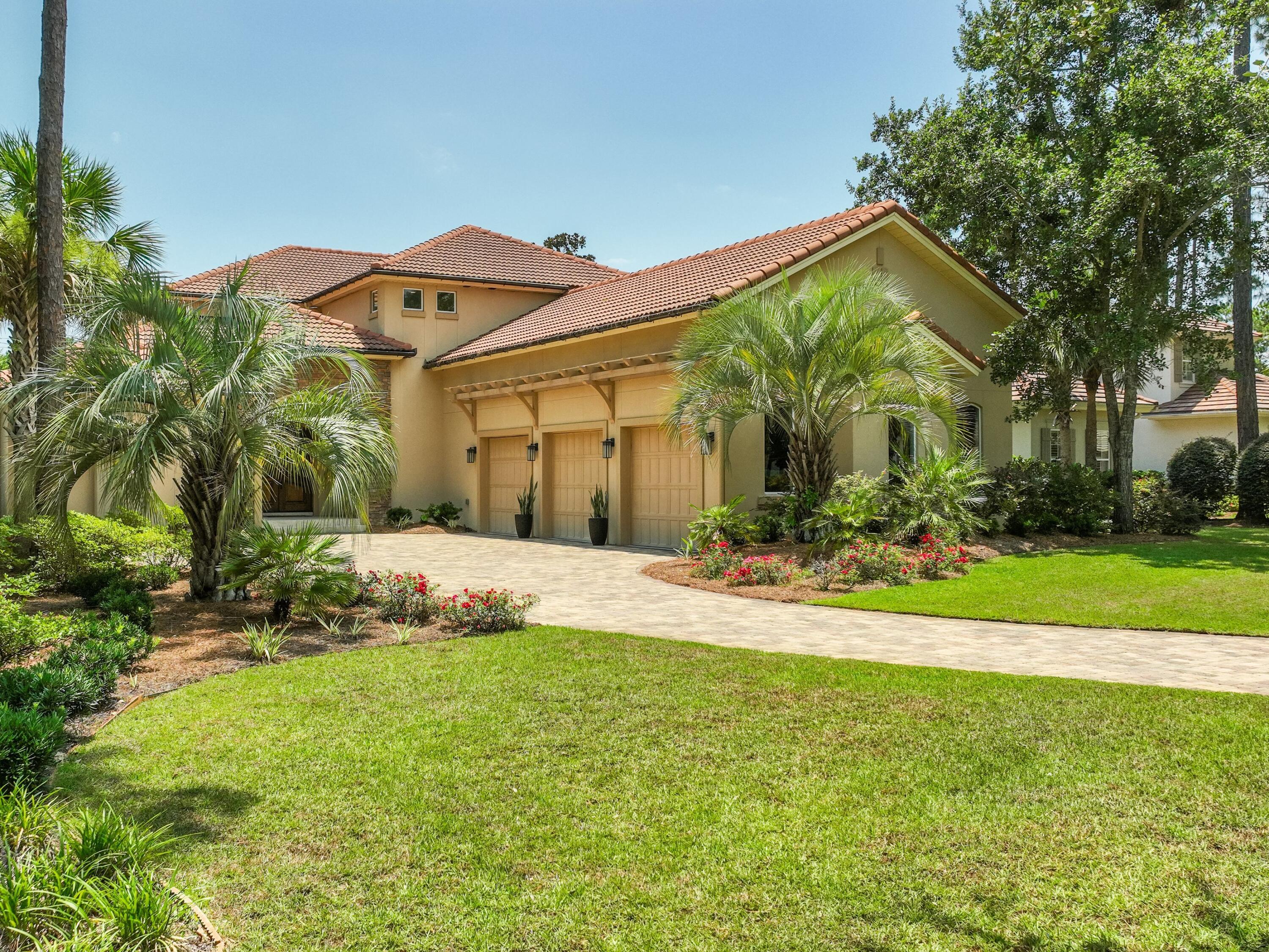 2916 Pine Valley Drive Sandestin, FL 32550 - Photo 46 of 48 a front view of a house with a yard
