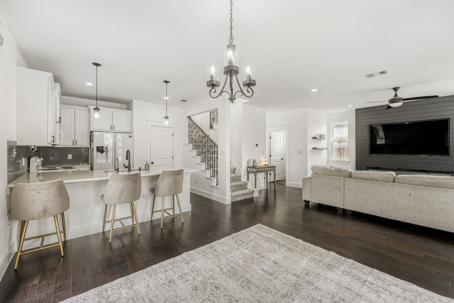 a living room with furniture and a flat screen tv