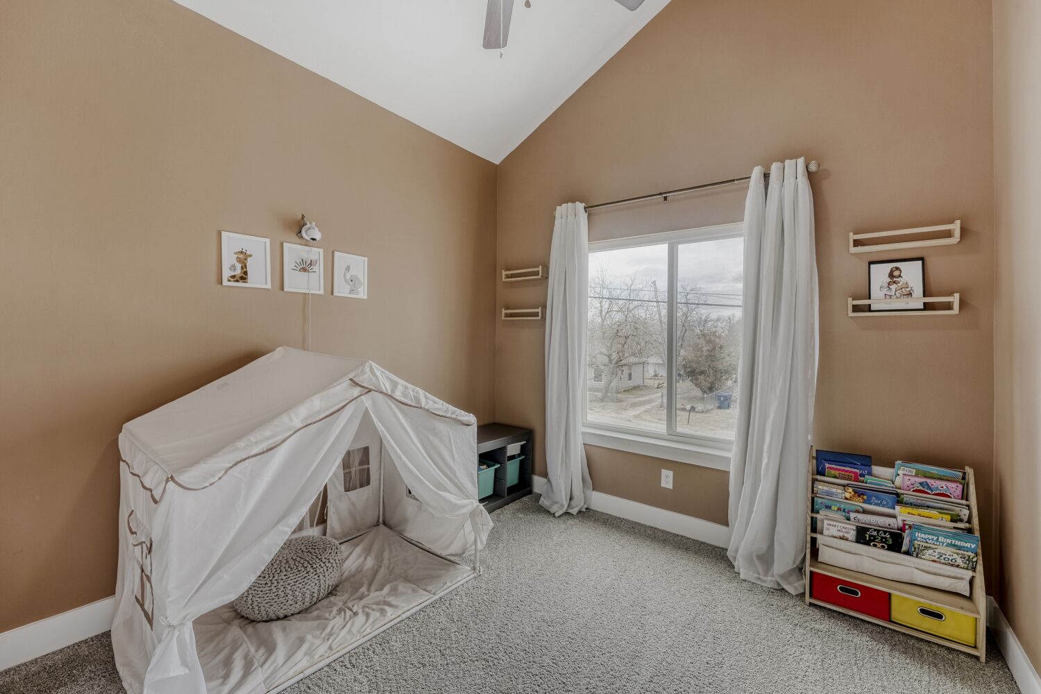 125 Irene Street Elgin, TX 78621 - Photo 17 of 24 Bedroom featuring carpet floors, lofted ceiling, and ceiling fan