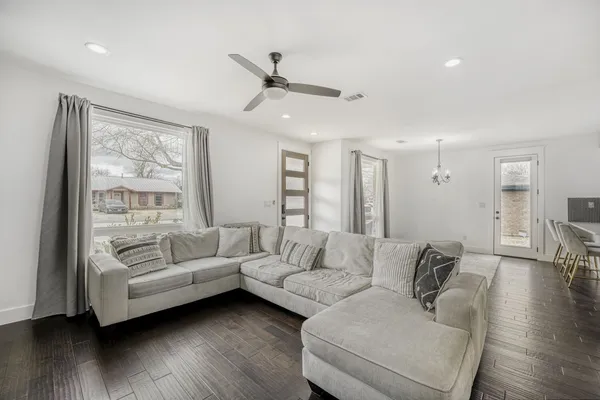 a living room with furniture and a large window