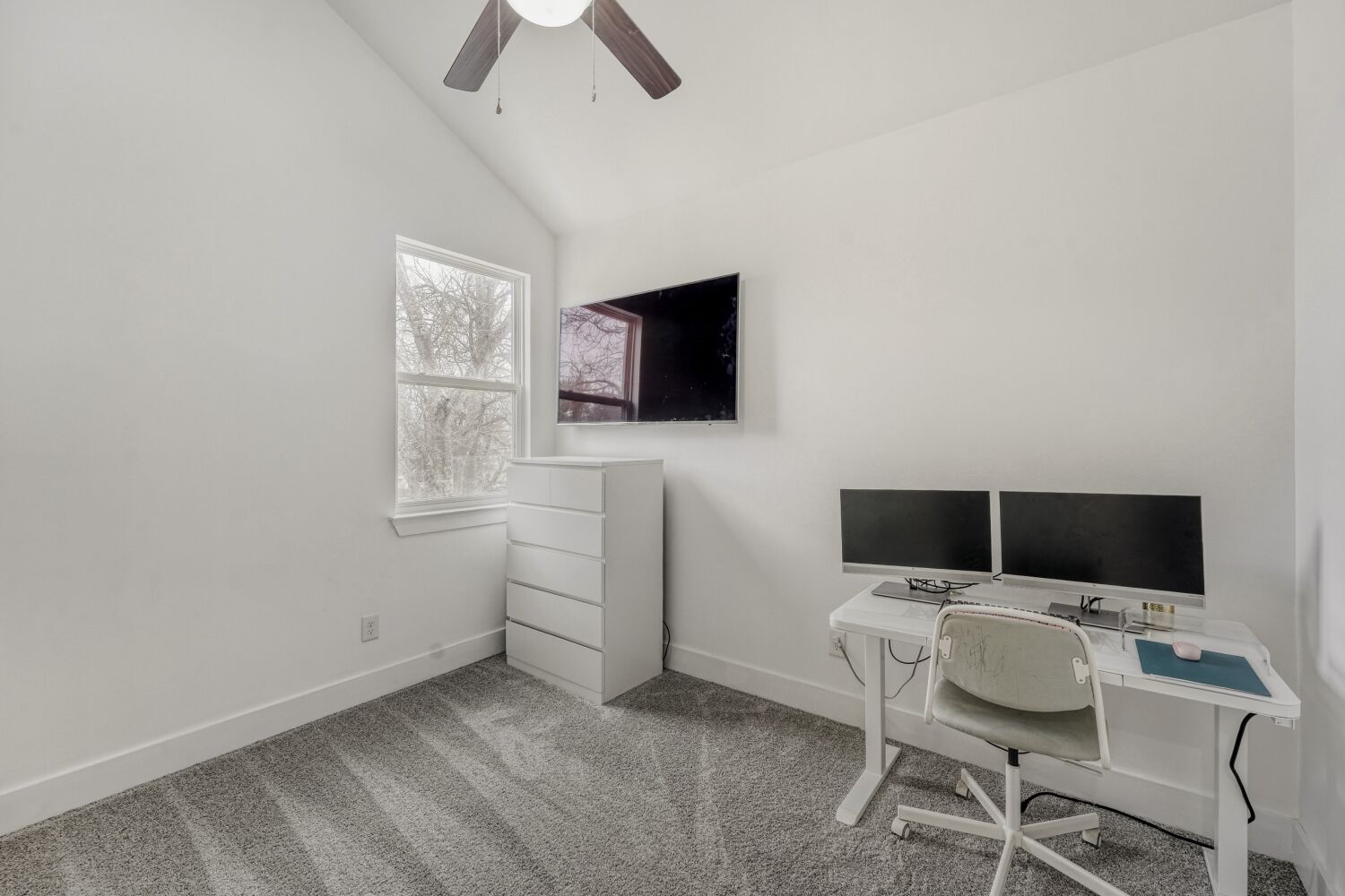 125 Irene Street Elgin, TX 78621 - Photo 9 of 24 Home office featuring vaulted ceiling, carpet, and ceiling fan