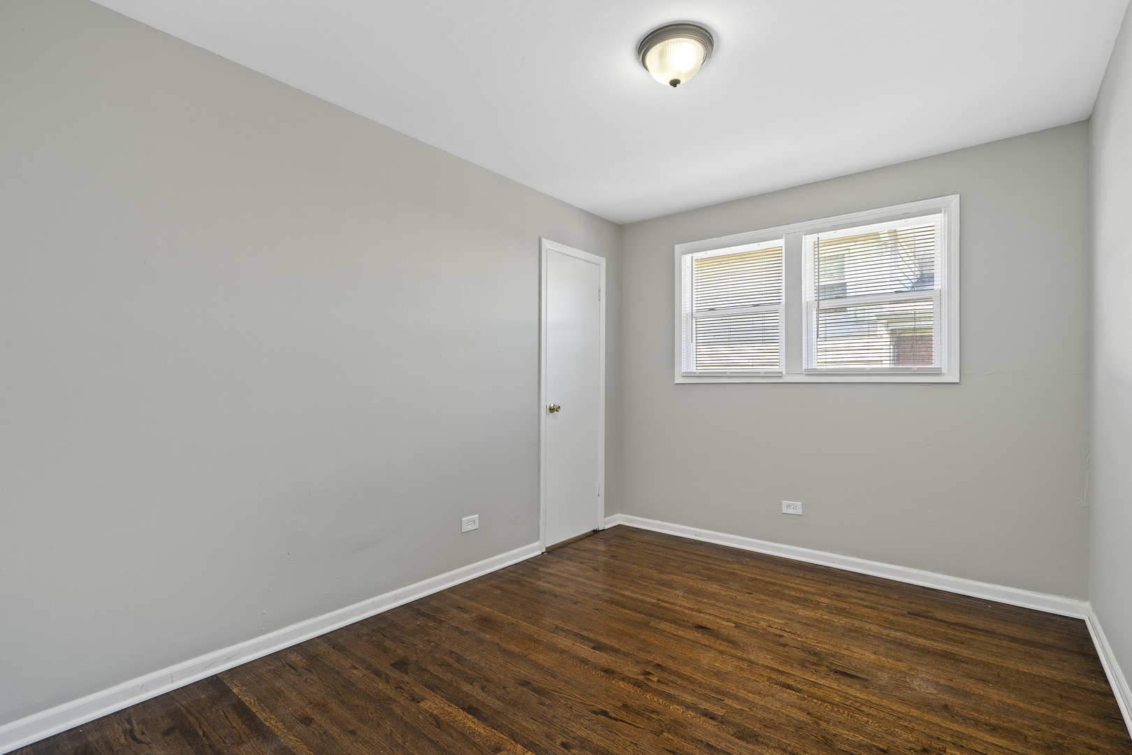 11442 South Aberdeen Street Chicago, IL 60643 - Photo 13 of 19 an empty room with wooden floor and windows