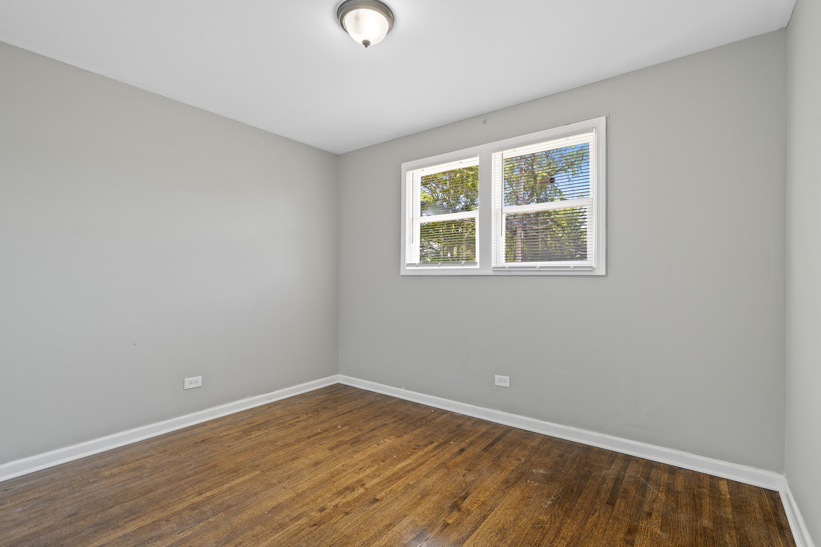 11442 South Aberdeen Street Chicago, IL 60643 - Photo 15 of 19 an empty room with wooden floor and windows