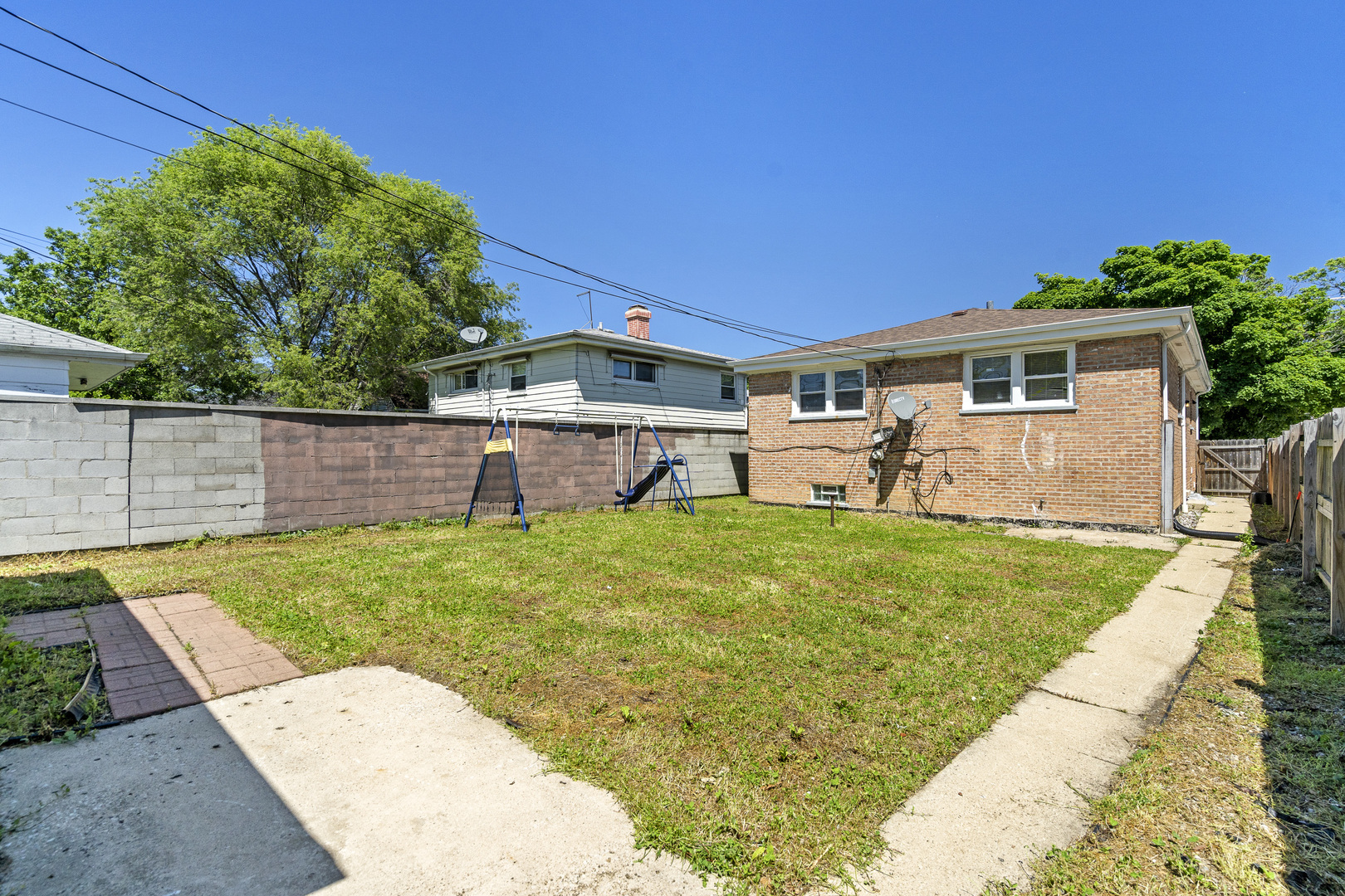 11442 South Aberdeen Street Chicago, IL 60643 - Photo 4 of 19 a view of a backyard with table and chairs potted plants and a palm tree