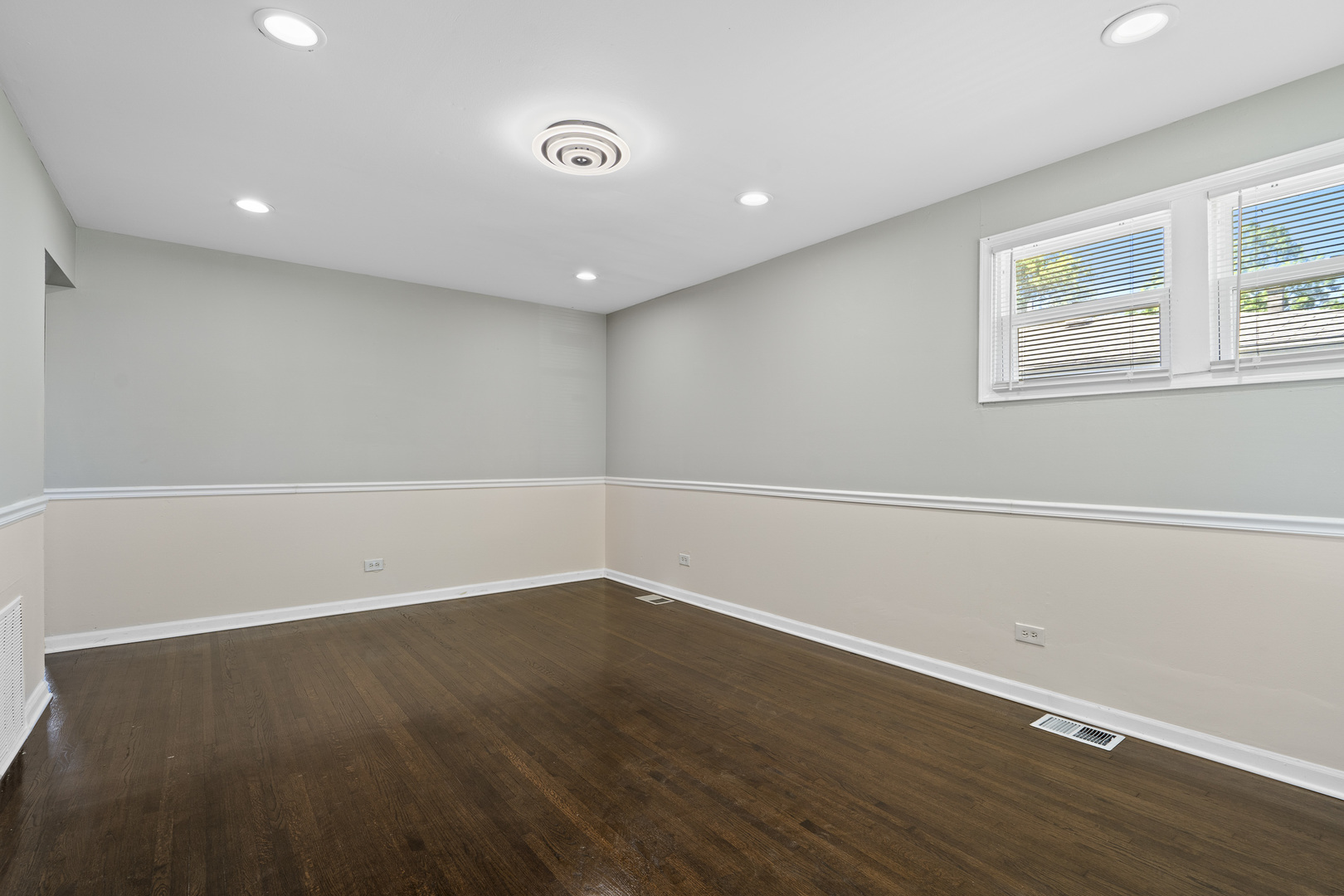 11442 South Aberdeen Street Chicago, IL 60643 - Photo 6 of 19 an empty room with wooden floor and windows