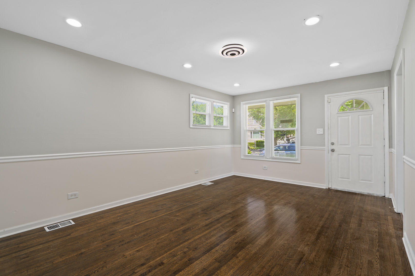 11442 South Aberdeen Street Chicago, IL 60643 - Photo 7 of 19 an empty room with wooden floor and windows