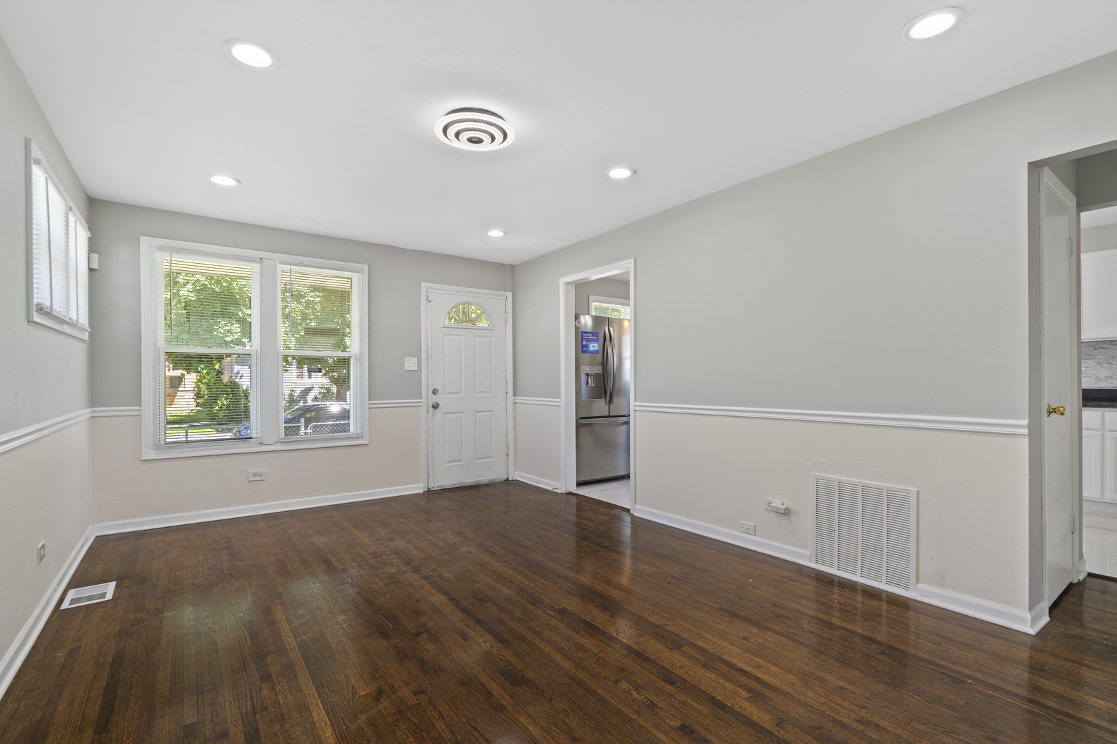 11442 South Aberdeen Street Chicago, IL 60643 - Photo 8 of 19 an empty room with wooden floor and windows