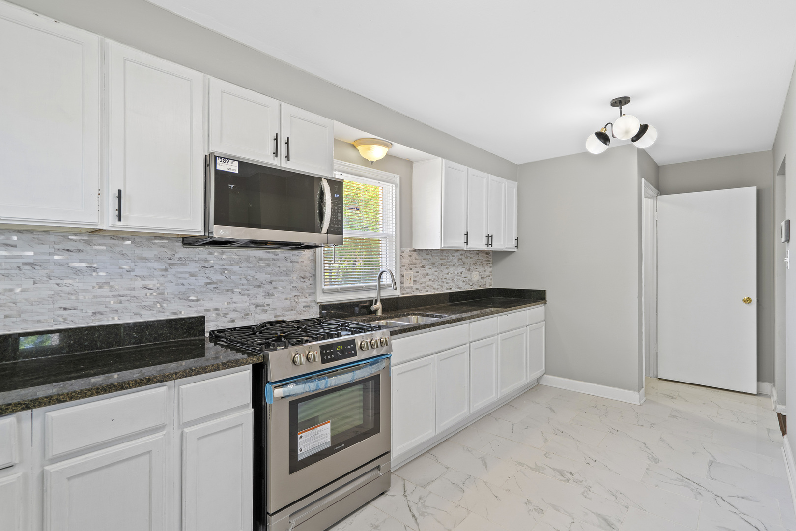 11442 South Aberdeen Street Chicago, IL 60643 - Photo 10 of 19 a kitchen with stainless steel appliances granite countertop white cabinets and stove