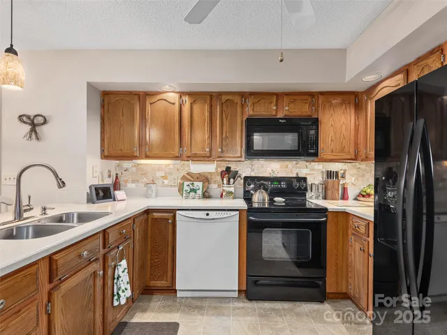 a kitchen with a sink stove and refrigerator