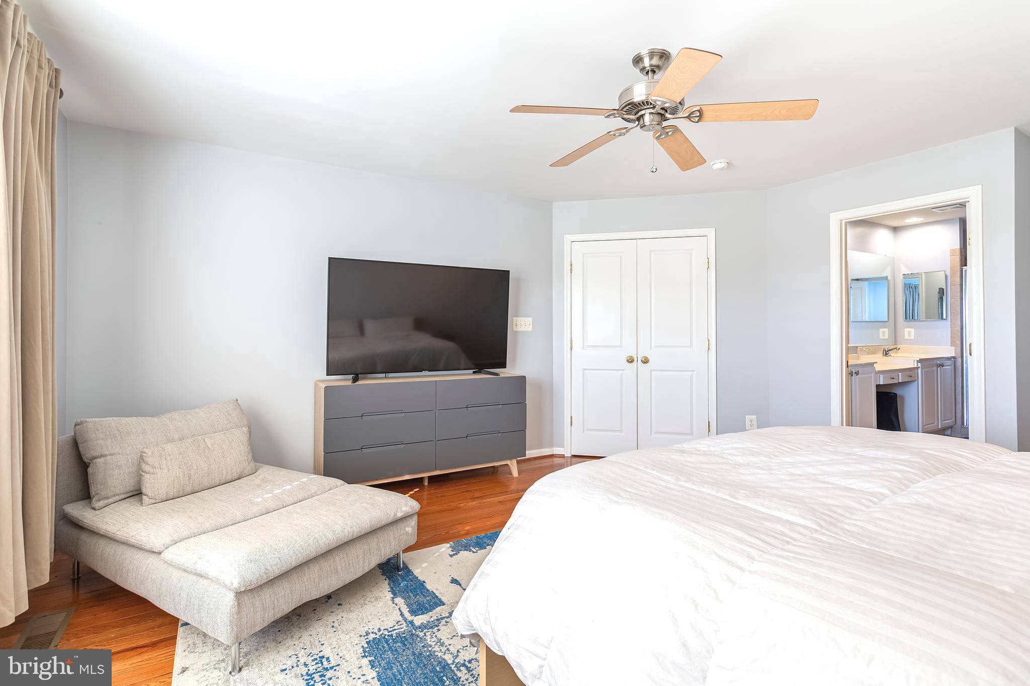 9152 Ribbon Falls Loop Bristow, VA 20136 - Photo 28 of 61 a bedroom with furniture and a flat screen tv