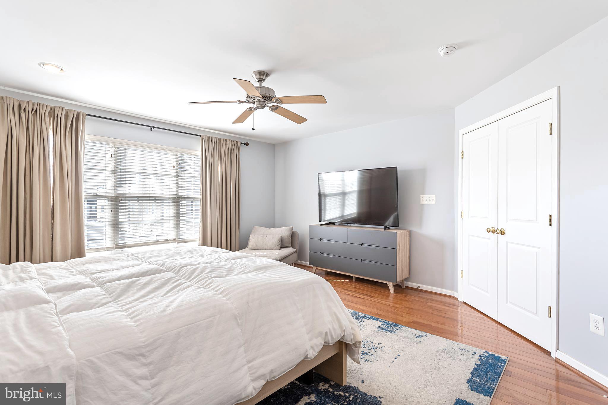 9152 Ribbon Falls Loop Bristow, VA 20136 - Photo 29 of 61 a bedroom with a large bed and a window