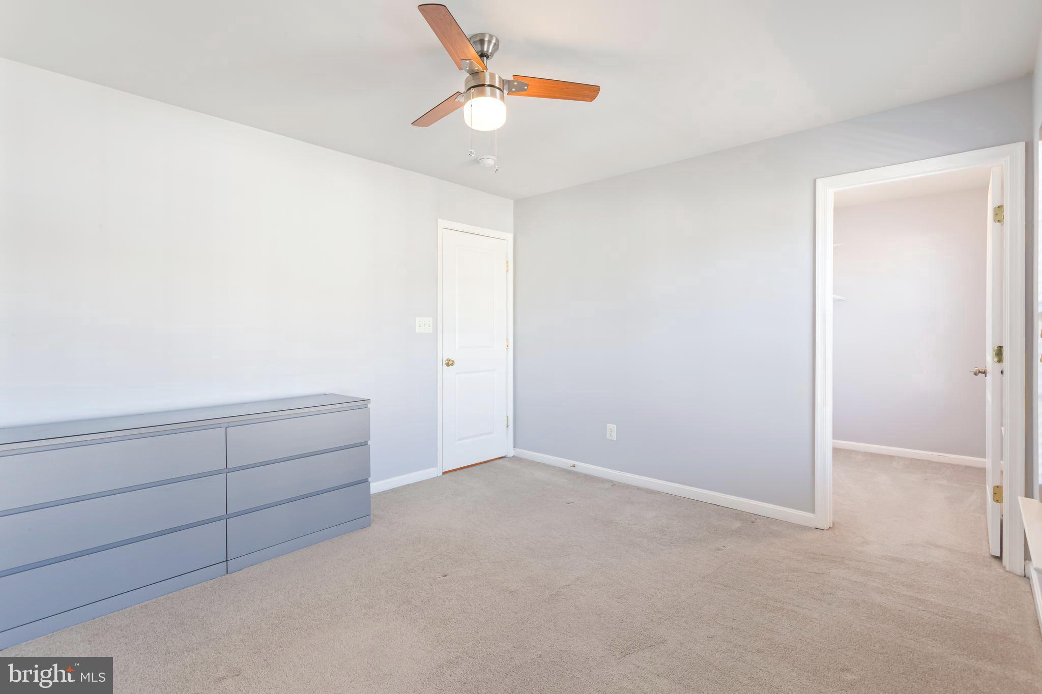 9152 Ribbon Falls Loop Bristow, VA 20136 - Photo 38 of 61 an empty room with cabinet and fan