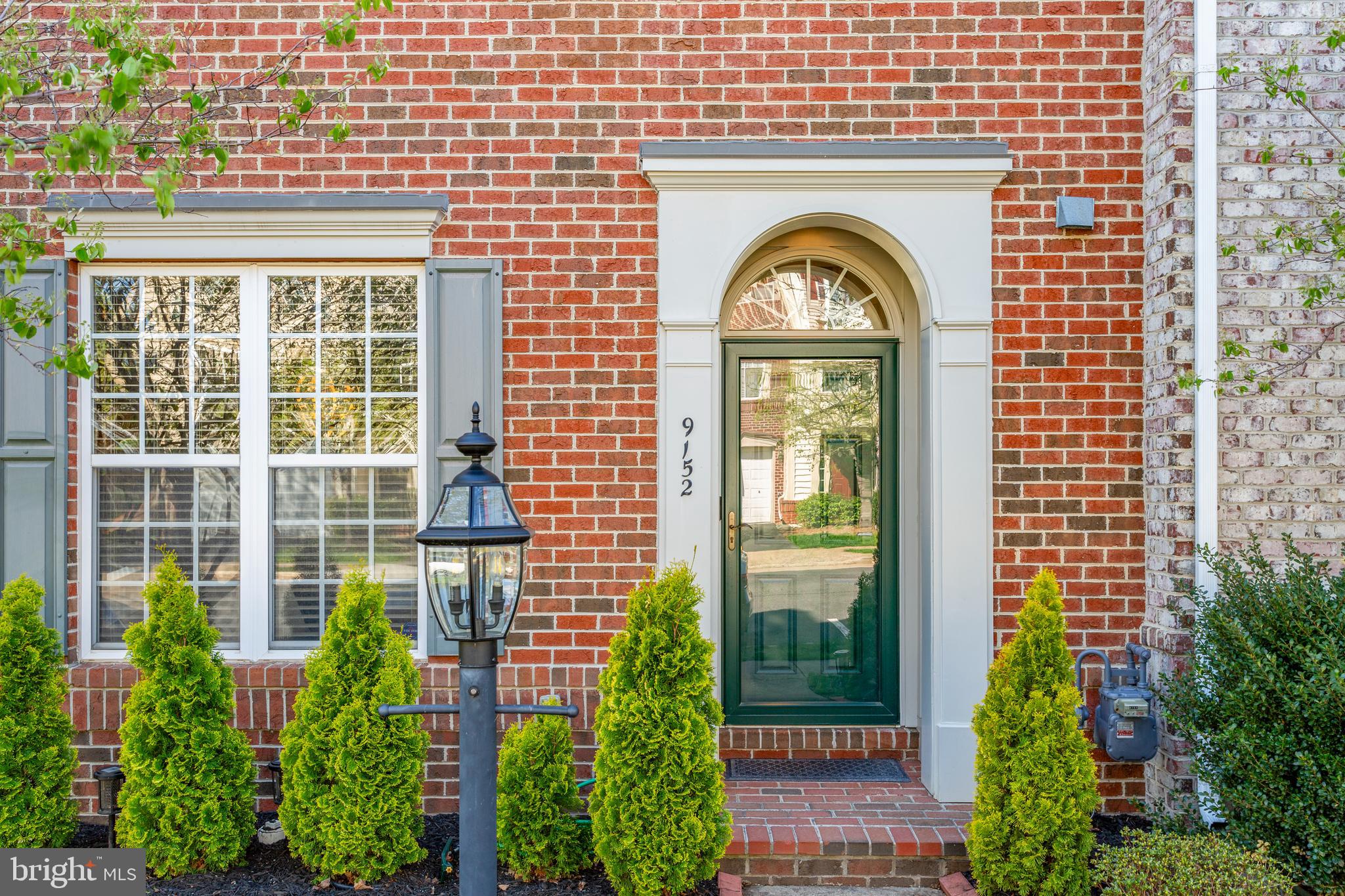 9152 Ribbon Falls Loop Bristow, VA 20136 - Photo 7 of 61 a view of a brick house with a large windows