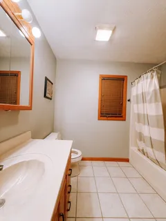 a view of a livingroom with hardwood floor and a ceiling fan