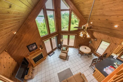 a view of a dining room with furniture and a window