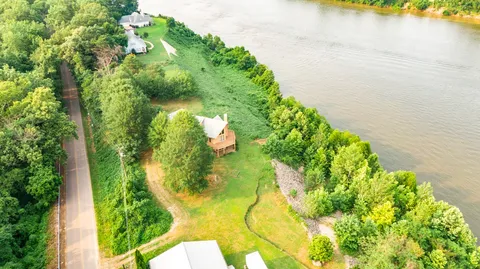 a view of a lake in middle of forest