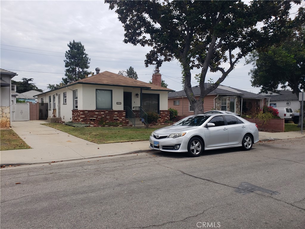 a view of street with parked cars