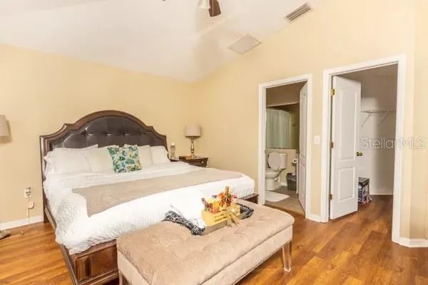 a living room with a bed and furniture