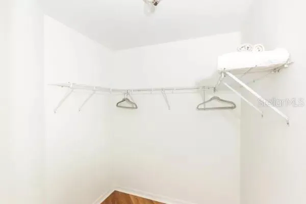 a bathroom with a sink vanity mirror and toilet