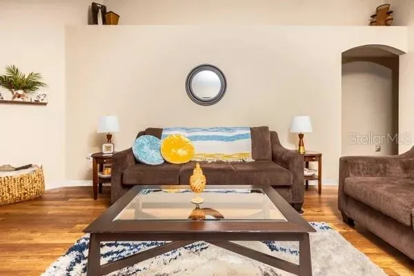 a living room with furniture and a table