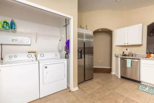 a view of storage and utility room with washer and dryer