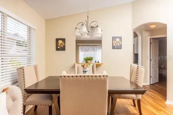 a dining room with furniture and window