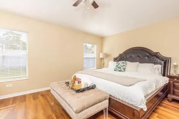 a bedroom with a bed and dresser