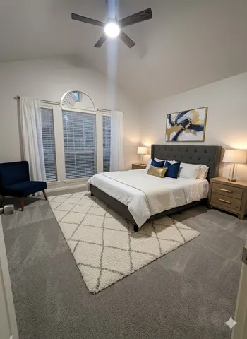 a bedroom with a bed and window