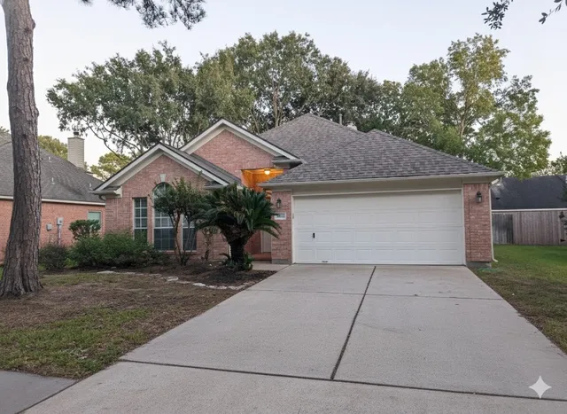 a front view of house with yard and trees