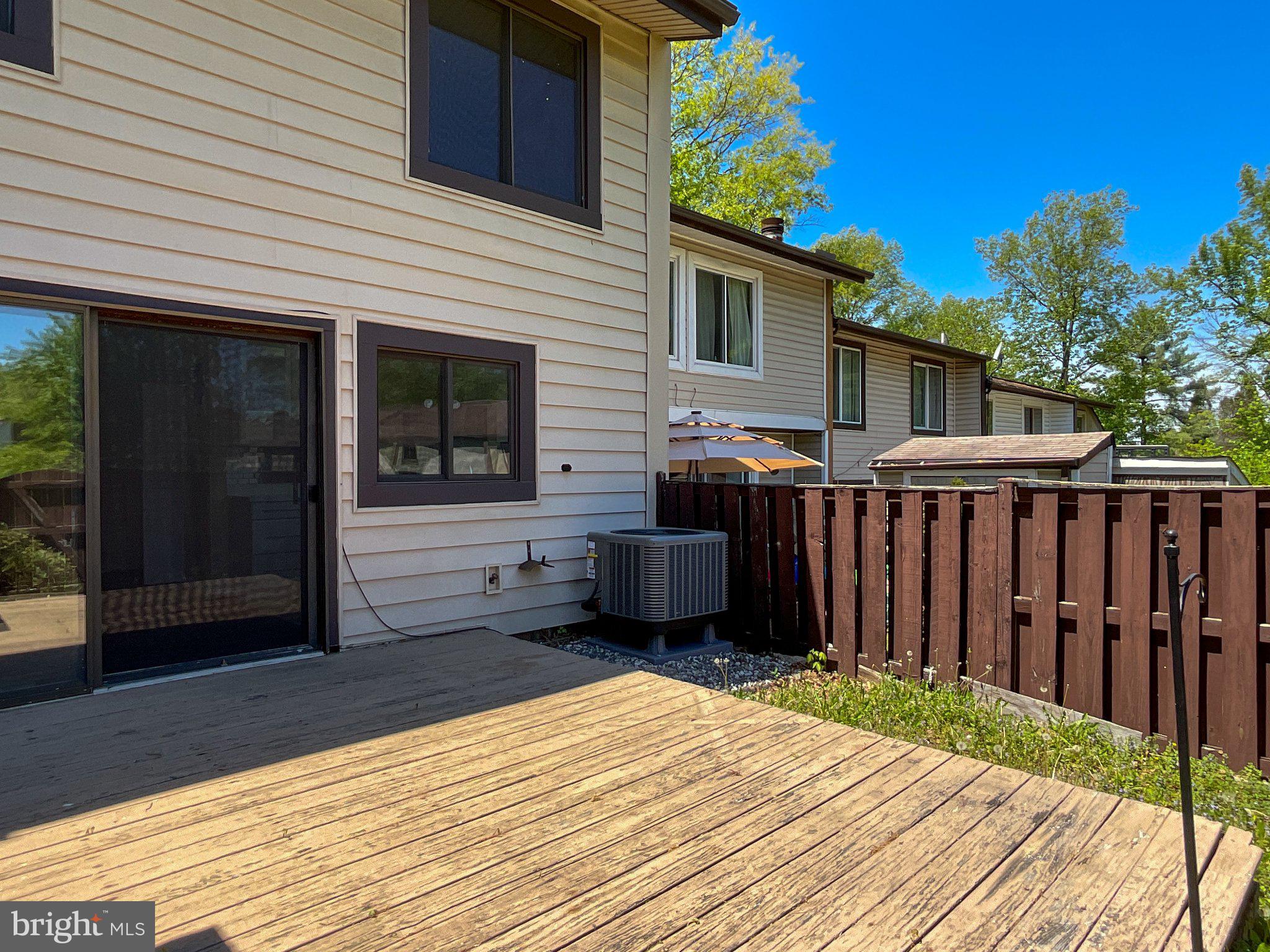 9040 Centerway Road Gaithersburg, MD 20879 - Photo 41 of 45 Sunny backyard retreat with wooden deck.