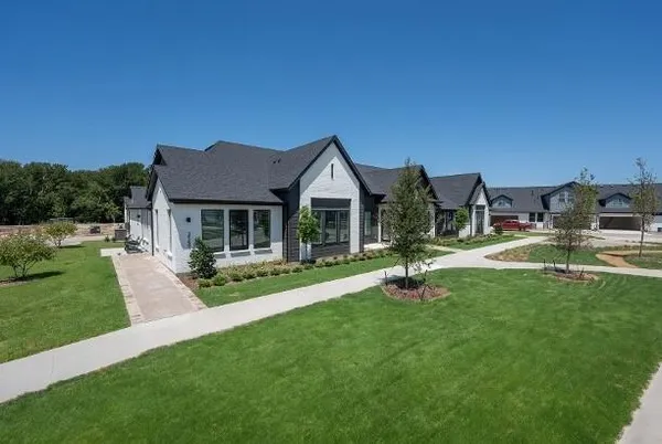 a backyard of a house with lots of green space