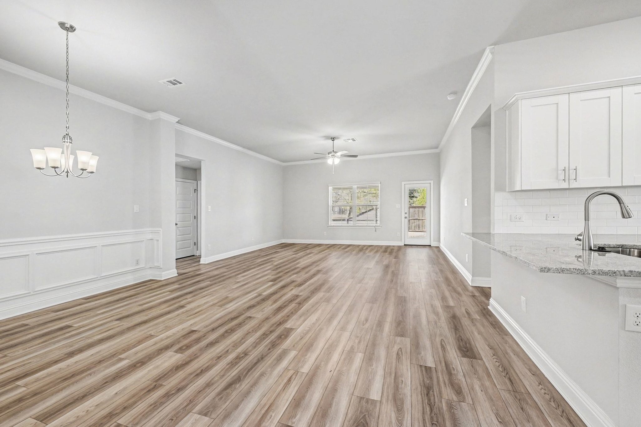 601 Greystone Lane Angleton, TX 77515 - Photo 6 of 32 a view of empty room with wooden floor and fan