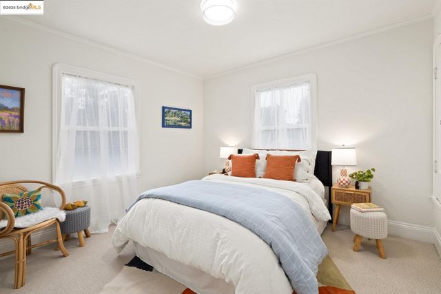 a room with furniture a rug and gym equipment