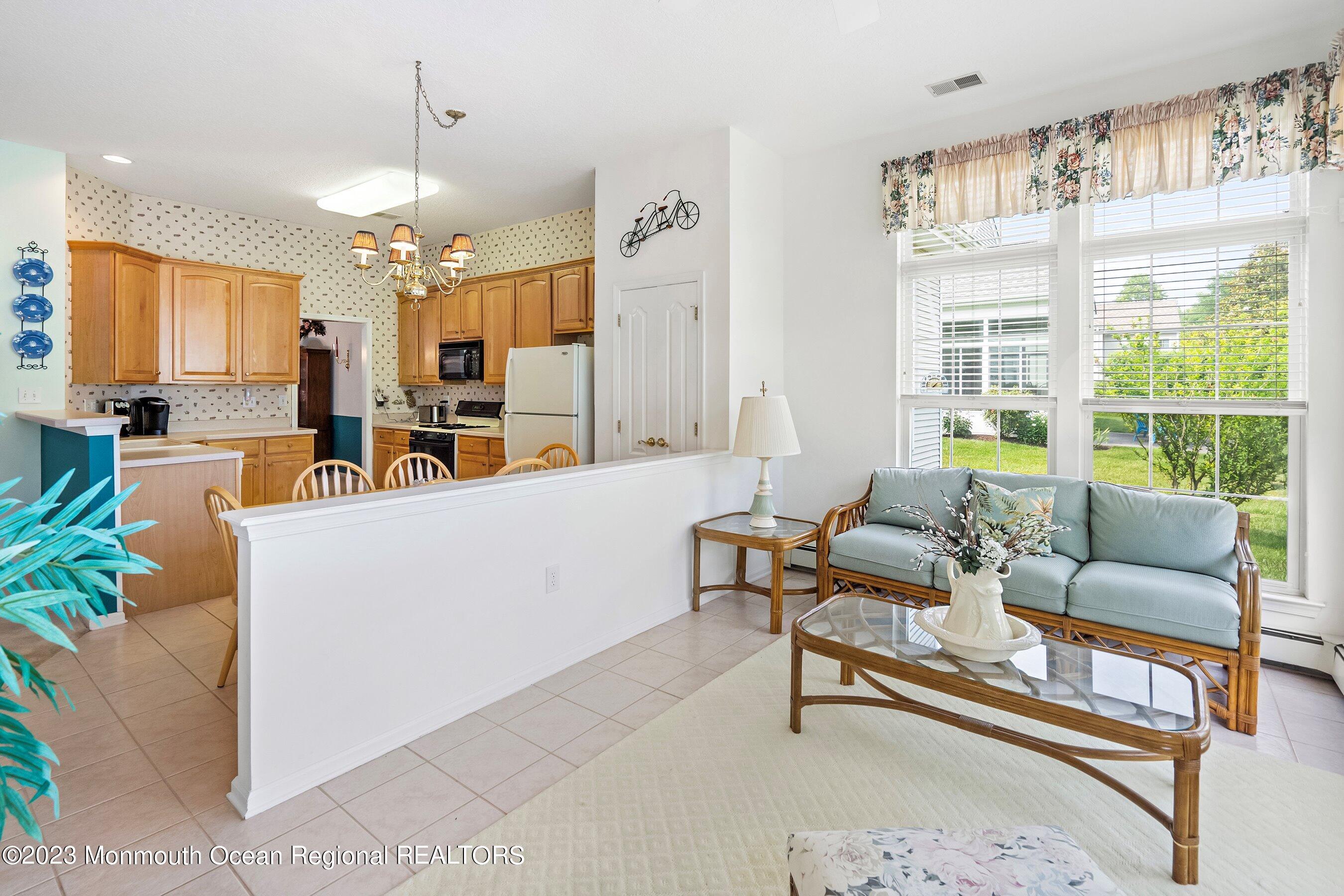 2564 Collier Road Manasquan, NJ 08736 - Photo 14 of 41 16-Sunroom to Breakfast and Kitchen