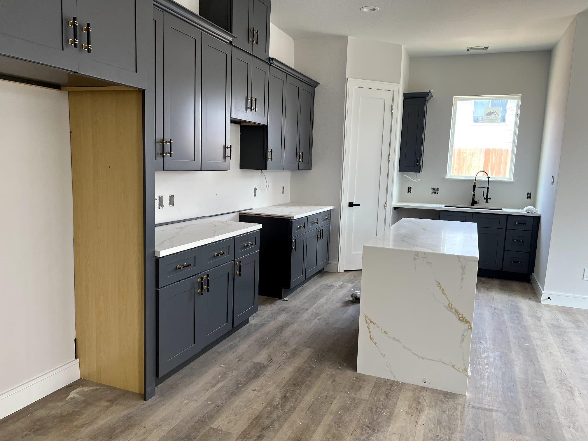 6407 Sidney Street Houston, TX 77021 - Photo 5 of 8 a large kitchen with stainless steel appliances a sink and cabinets