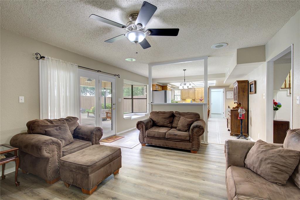 753 County Rd SW 3110 Mount Vernon, TX 75457 - Photo 9 of 40 Living room is open to kitchen/breakfast area, with glass doors to the back porch and pool area.