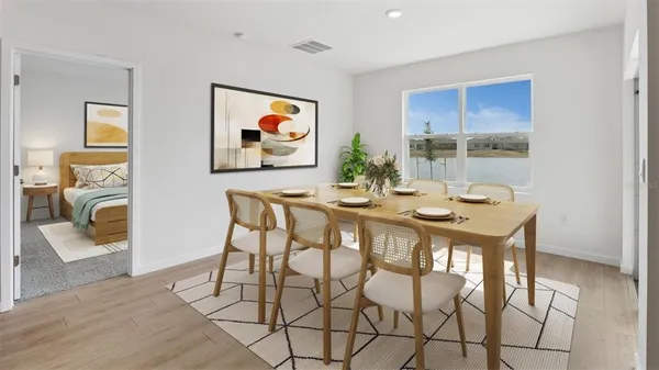 a dining room with furniture and window