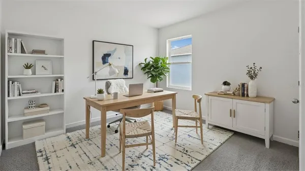 a view of a workspace with furniture