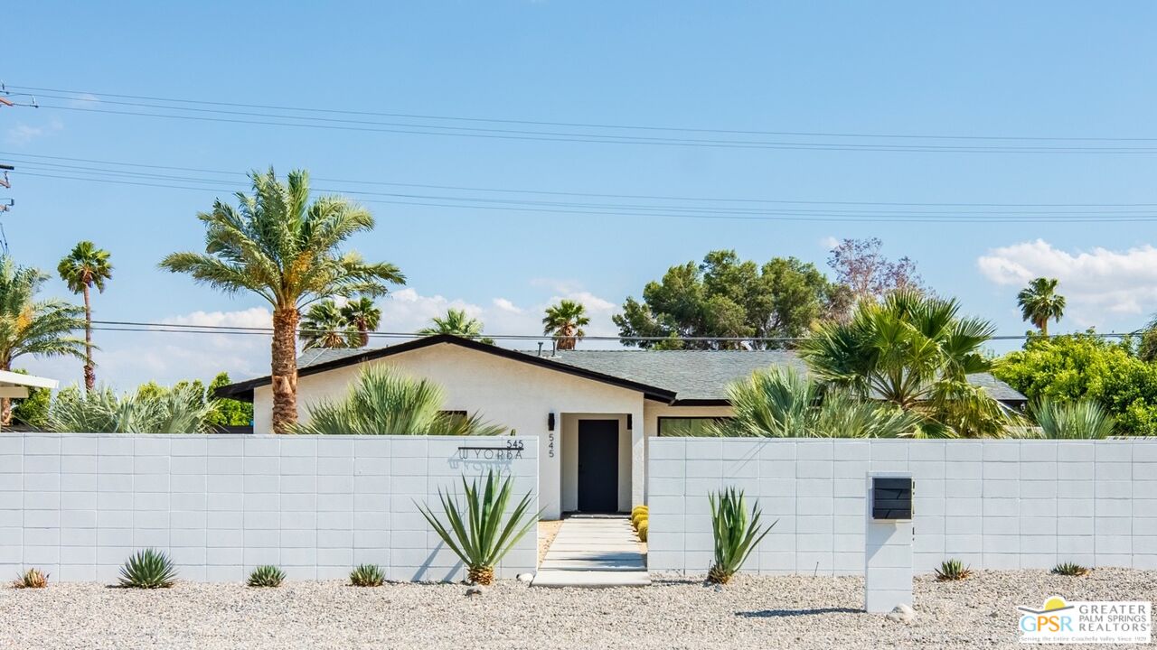 545 West Yorba Road Palm Springs, CA 92262 - Photo 1 of 72 a view of a house with a yard and potted plants