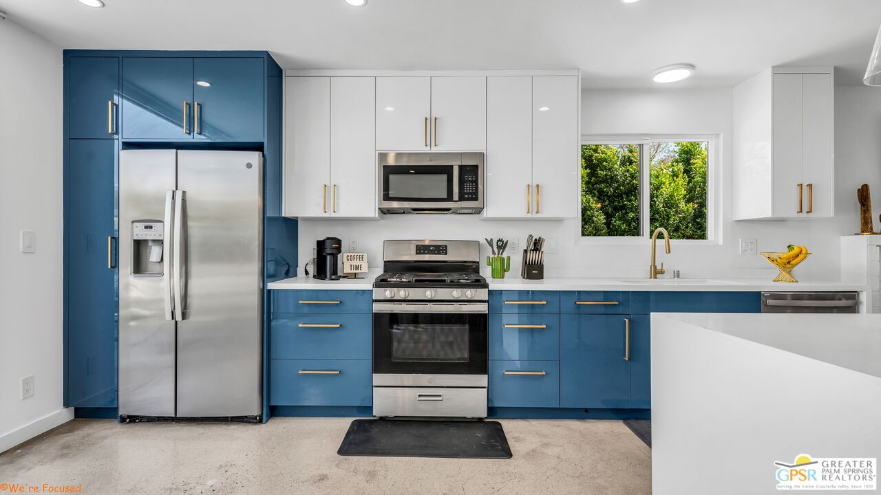 545 West Yorba Road Palm Springs, CA 92262 - Photo 11 of 72 a kitchen with stainless steel appliances granite countertop a stove a refrigerator and a sink