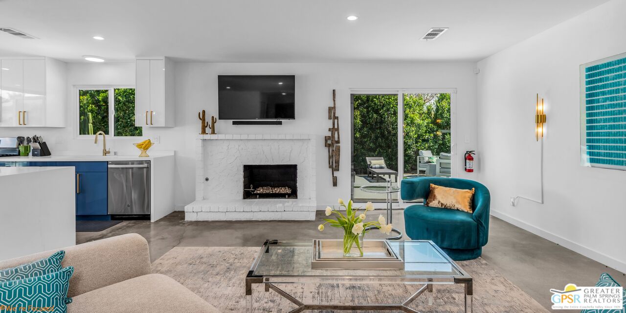 545 West Yorba Road Palm Springs, CA 92262 - Photo 13 of 72 a living room with furniture fireplace and a flat screen tv