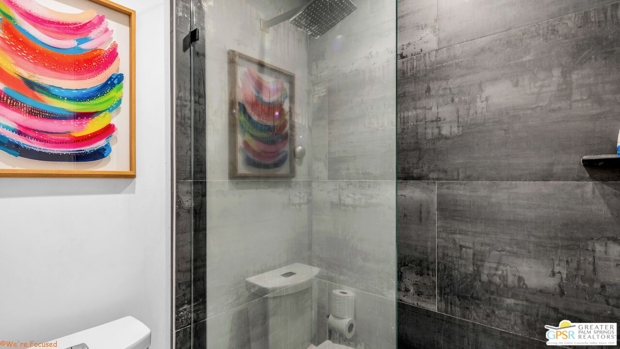 545 West Yorba Road Palm Springs, CA 92262 - Photo 23 of 72 a bathroom with a toilet and shower curtain