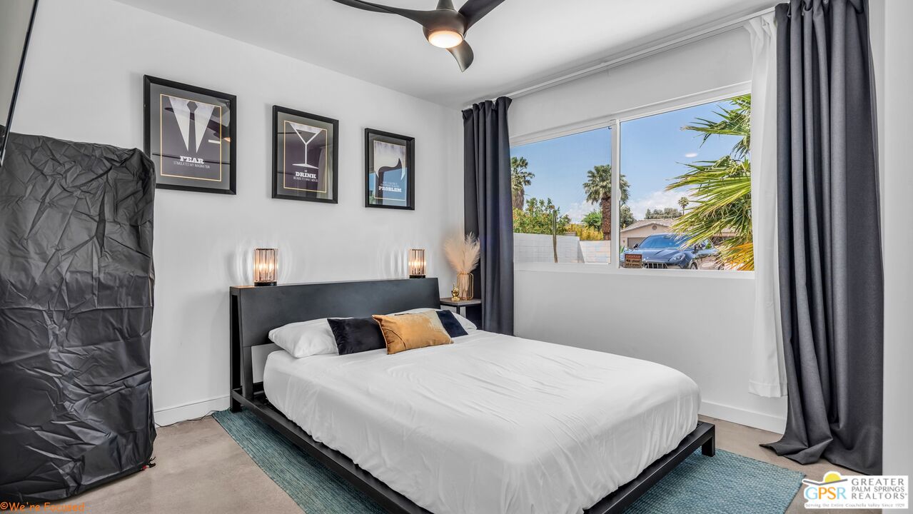 545 West Yorba Road Palm Springs, CA 92262 - Photo 28 of 72 a bedroom with a bed and a painting on the wall
