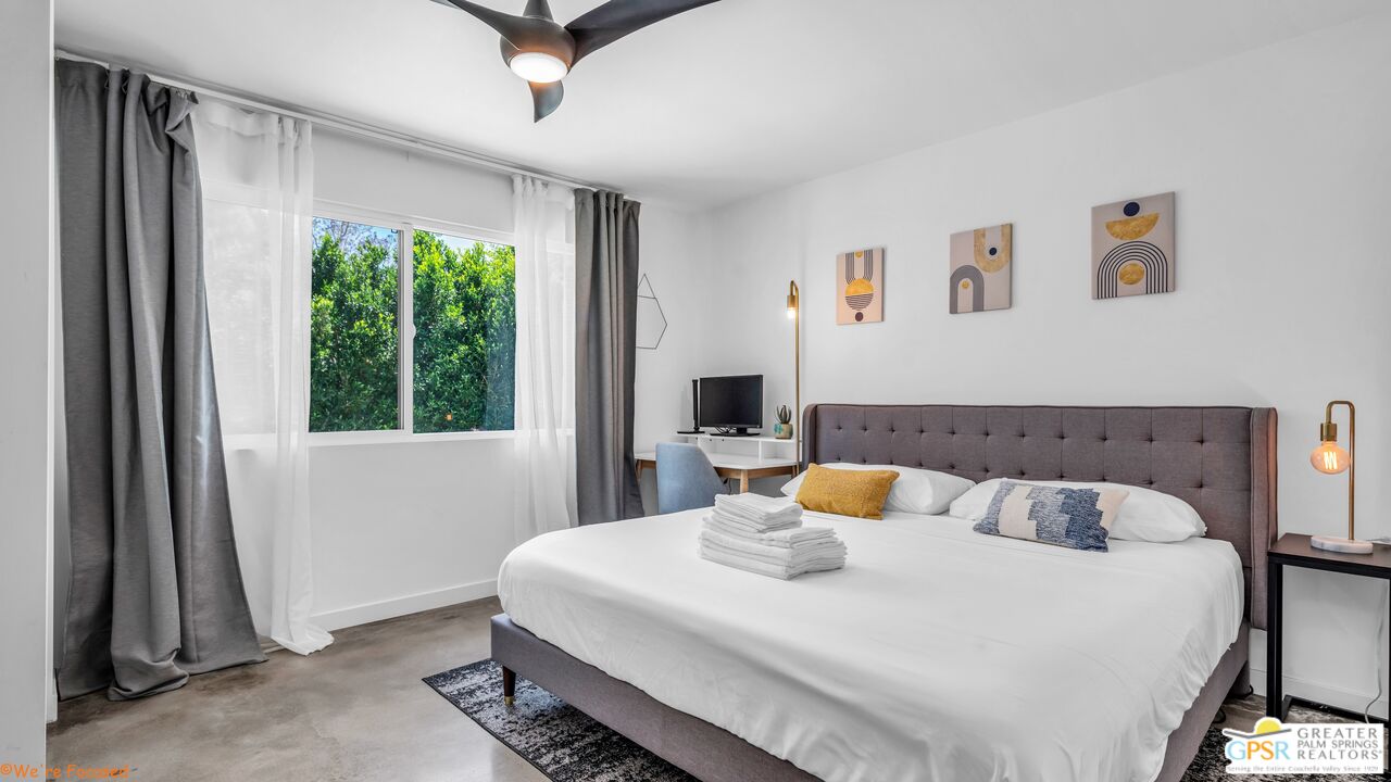 545 West Yorba Road Palm Springs, CA 92262 - Photo 33 of 72 a bedroom with a bed and a window