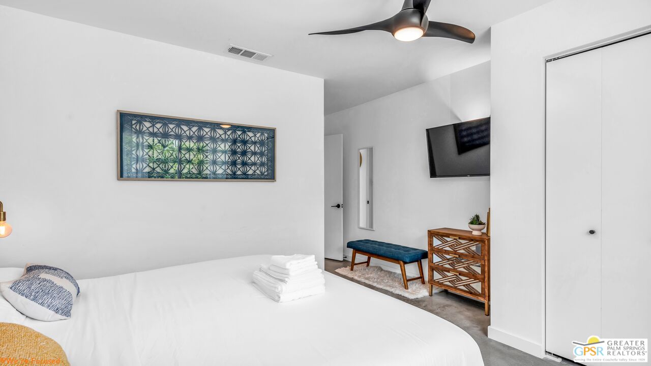 545 West Yorba Road Palm Springs, CA 92262 - Photo 35 of 72 a bedroom with a bed and a flat screen tv